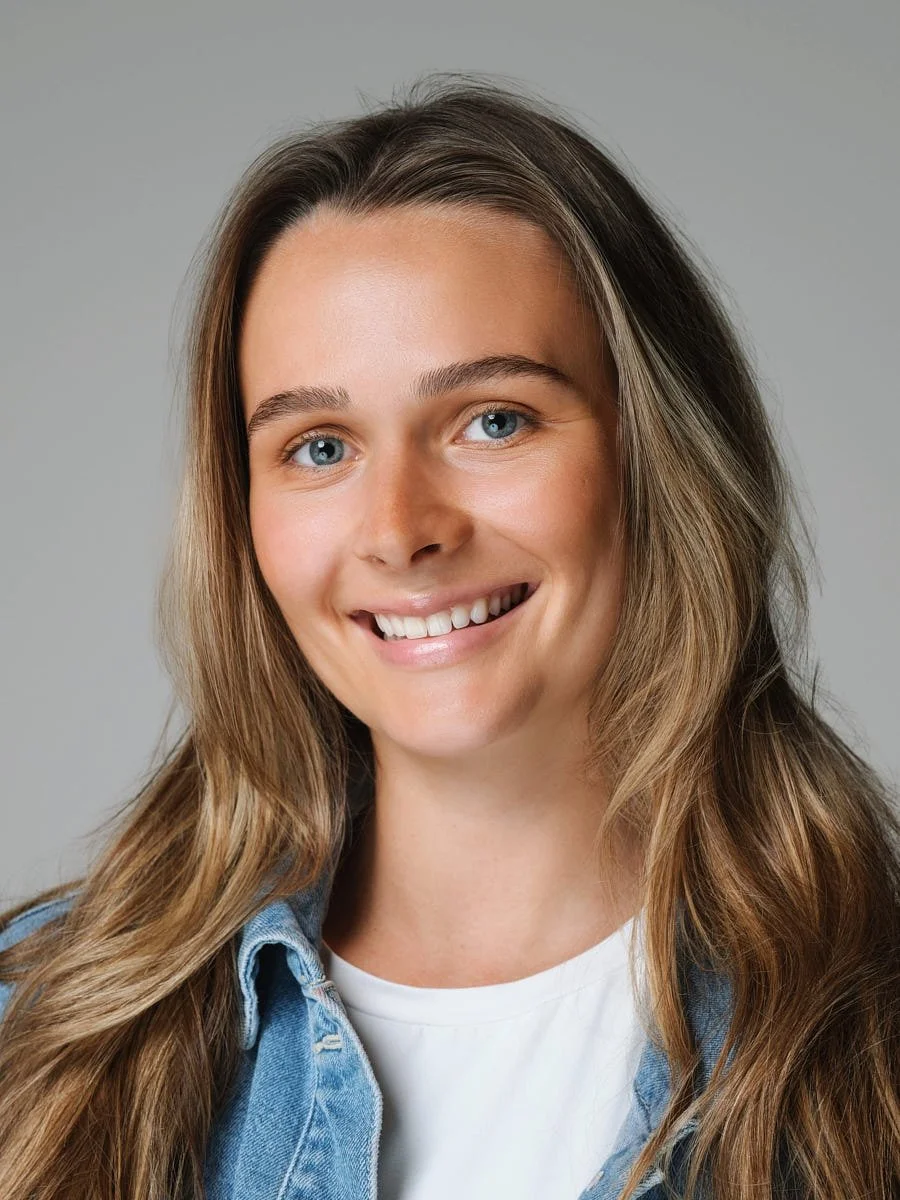 headshots-nyc-woman-denim-jacket-gray-background.jpg