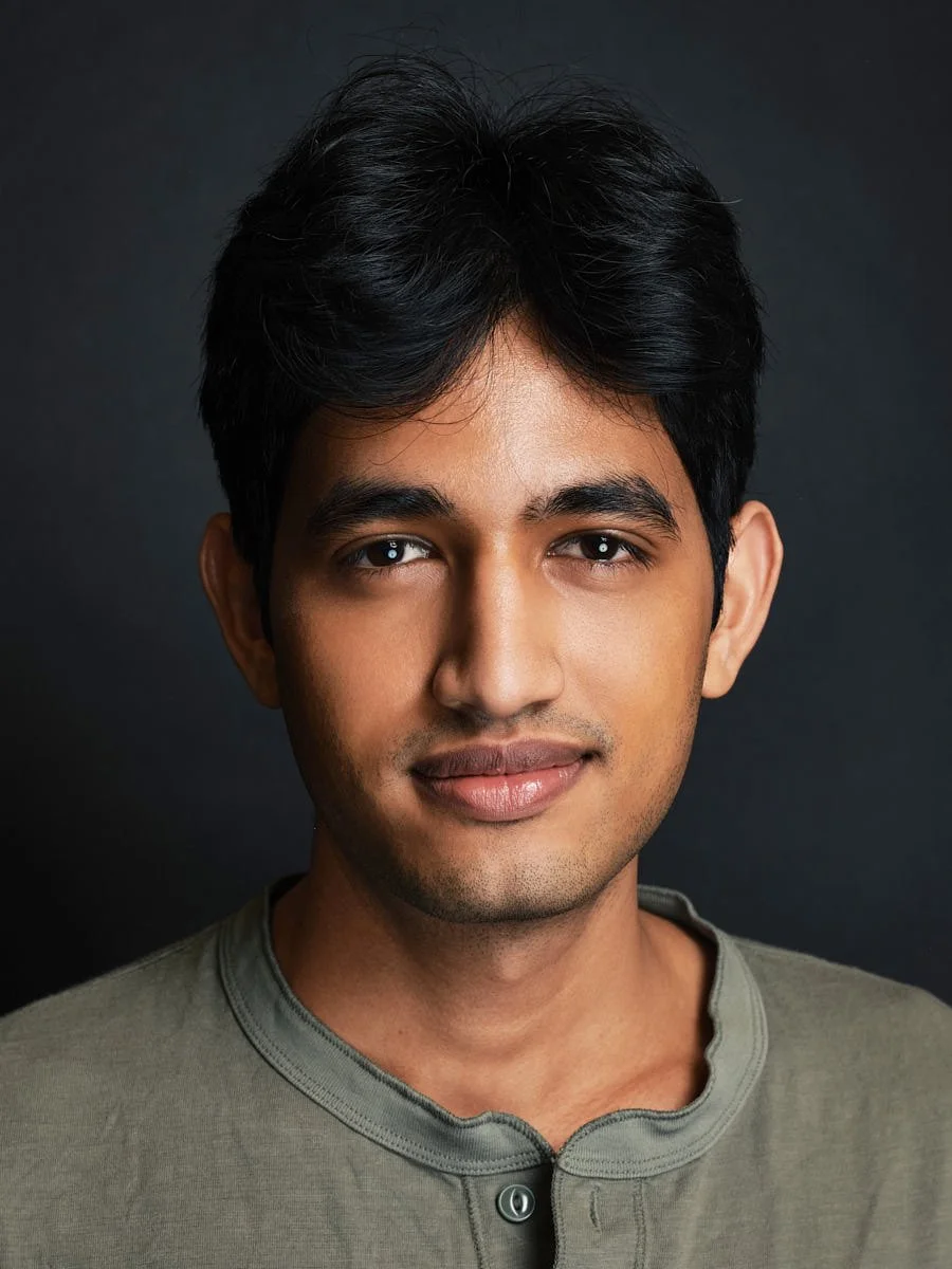 professional-headshot-nyc-man-green-shirt-dark-background.jpg