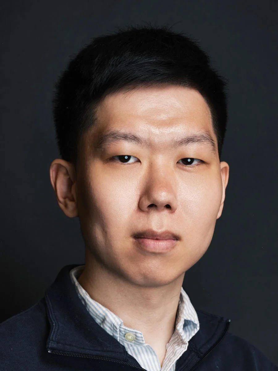 executive-portrait-nyc-man-navy-jacket-dark-background.jpg