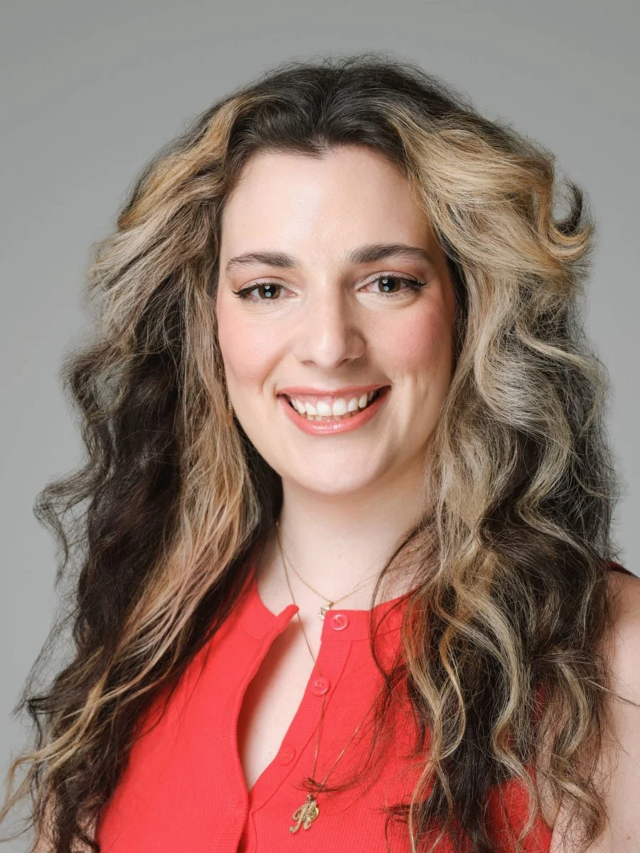 corporate-headshot-nyc-woman-red-blouse-gray-background.jpg