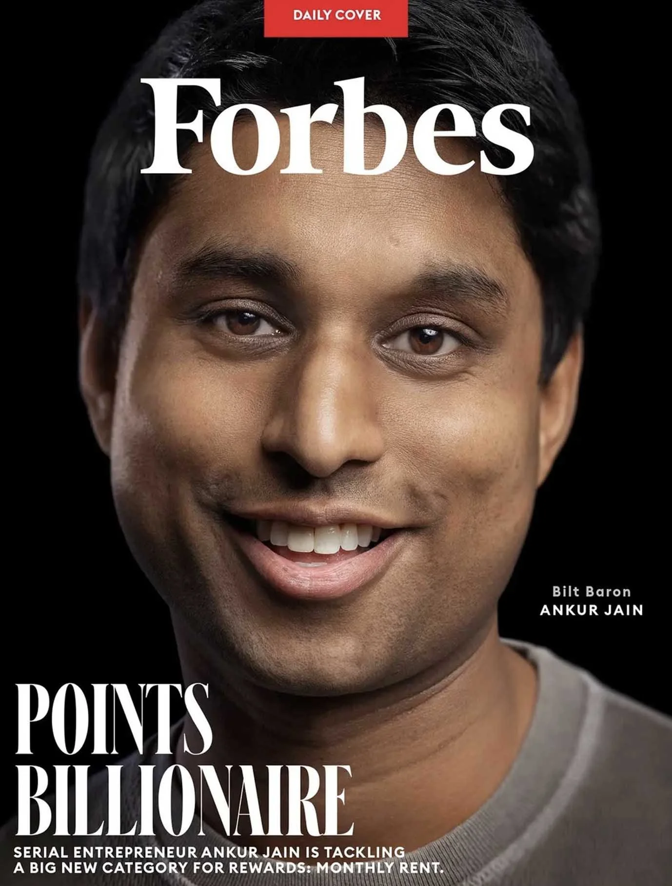 Magazine cover with a Forbes masthead, a smiling man, and the headline Points Billionaire.