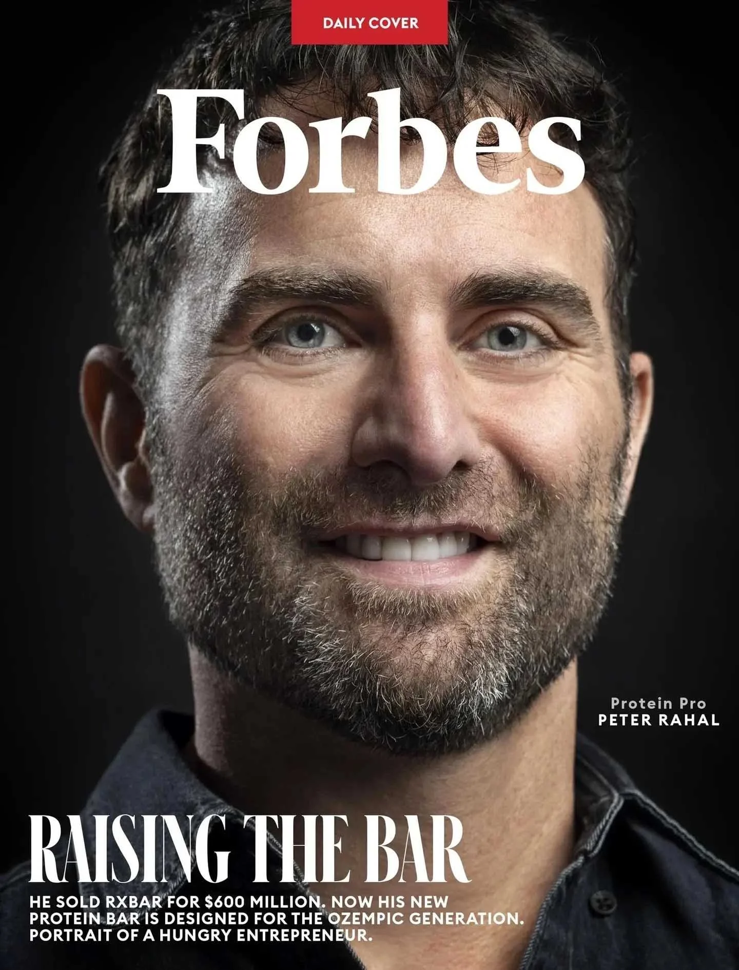 Magazine cover with a Forbes masthead, a smiling man, and the headline Raising the Bar.