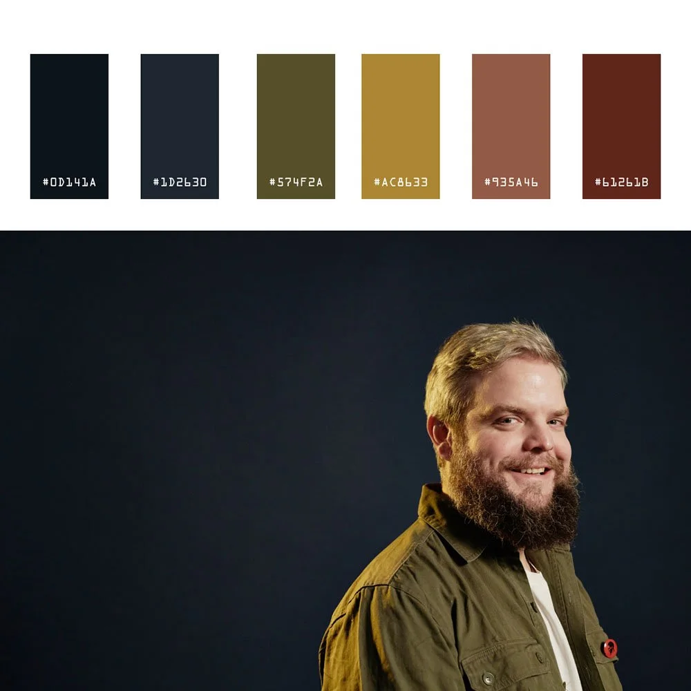 Color swatches above a portrait of a smiling bearded man against a dark background.